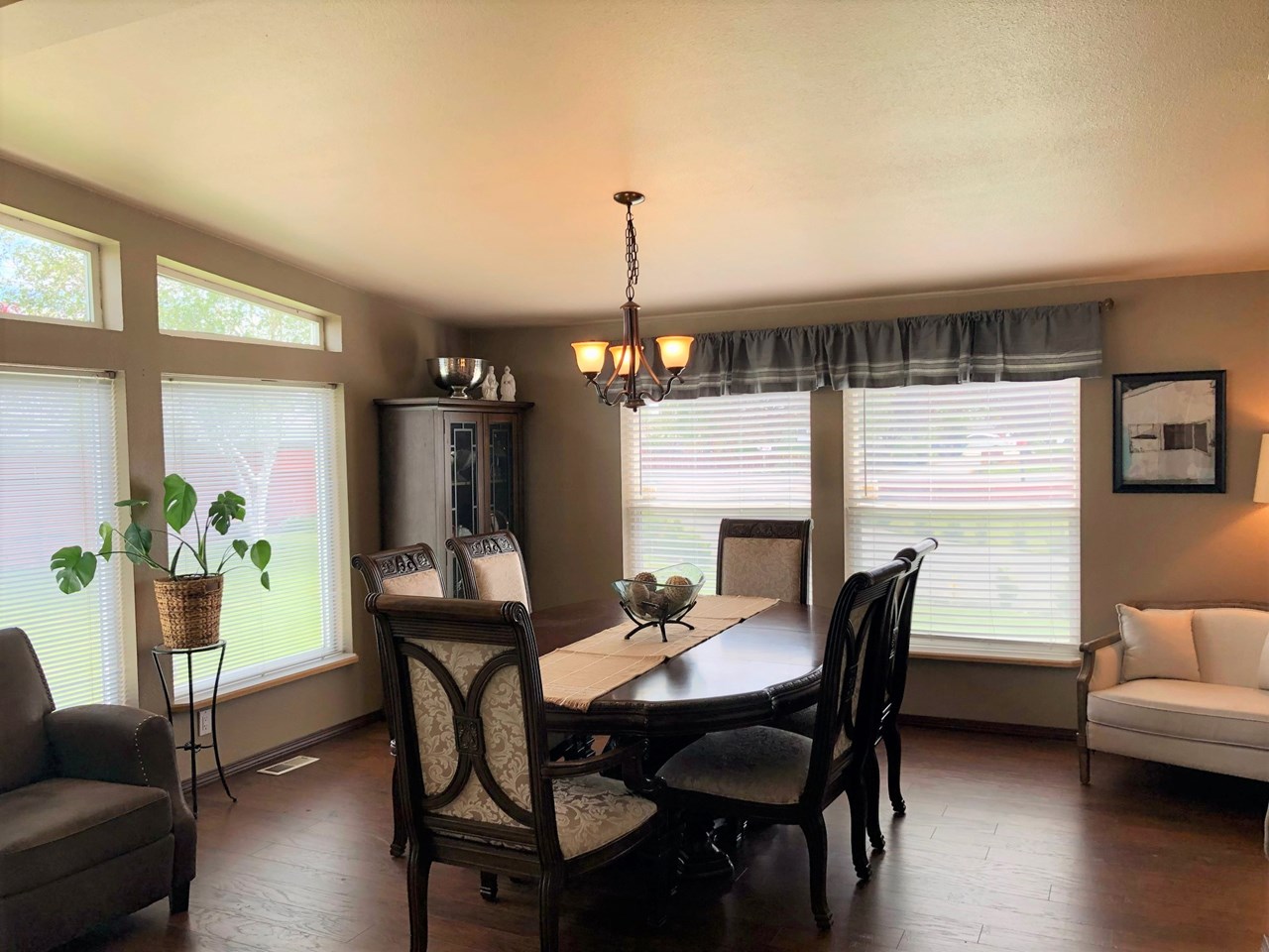 dining room with large picture windows adds so much natural light