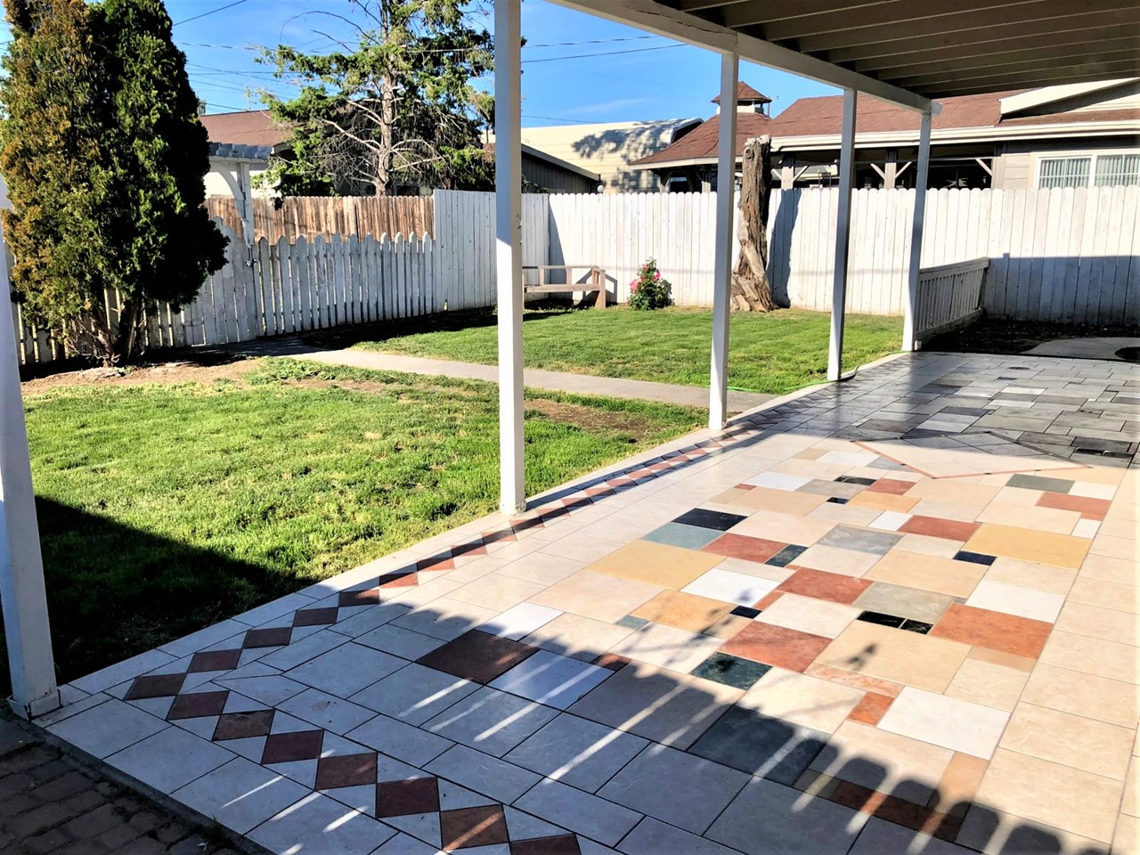 covered back patio with tiling