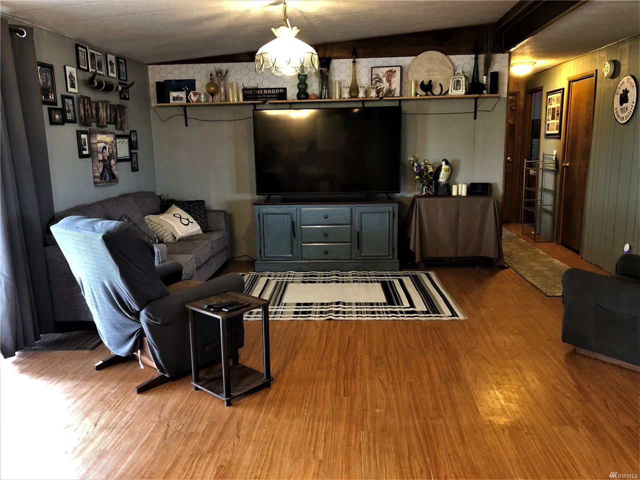 living room with laminate hardwood flooring