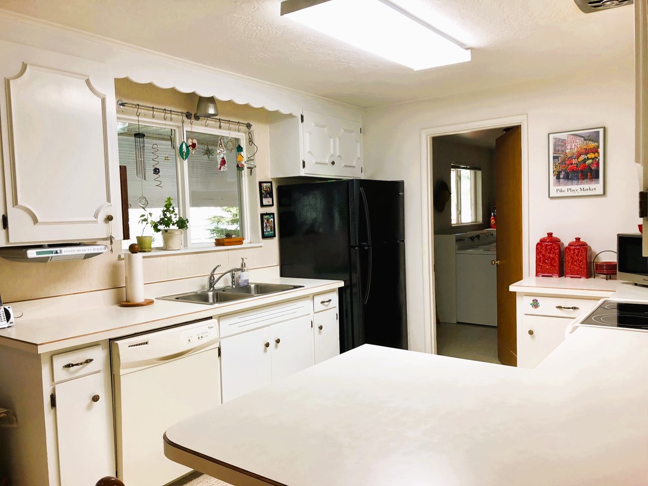 kitchen area leads to laundry room